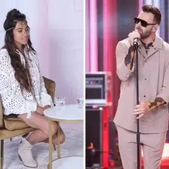 Grzegorz Hyży, król nocy, na scenie. Obok siedząca kobieta w białym swetrze.