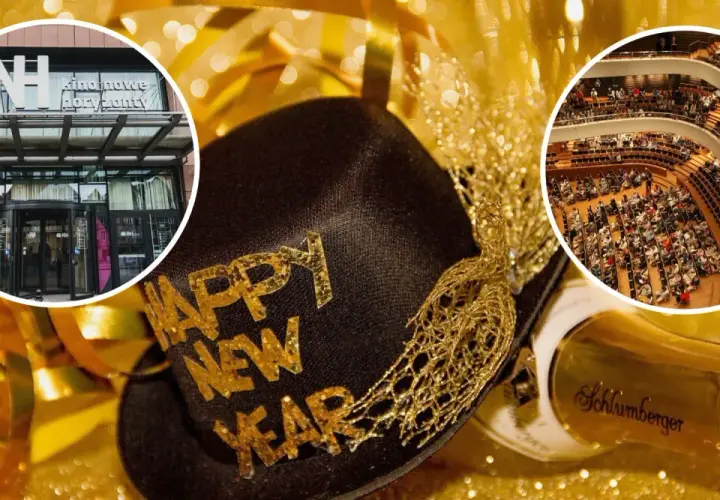 Złota czapka z napisem "Happy New Year", butelka szampana i widok na kino oraz salę koncertową.
