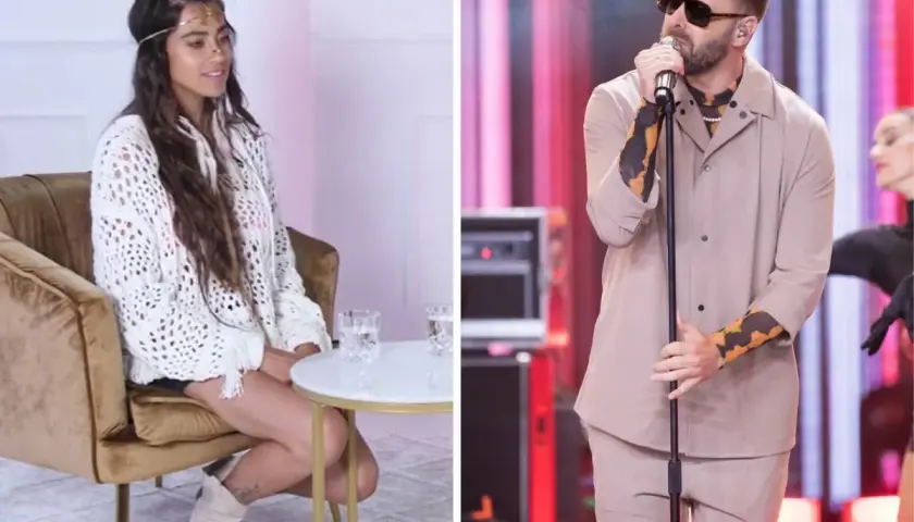 Grzegorz Hyży, król nocy, na scenie. Obok siedząca kobieta w białym swetrze.